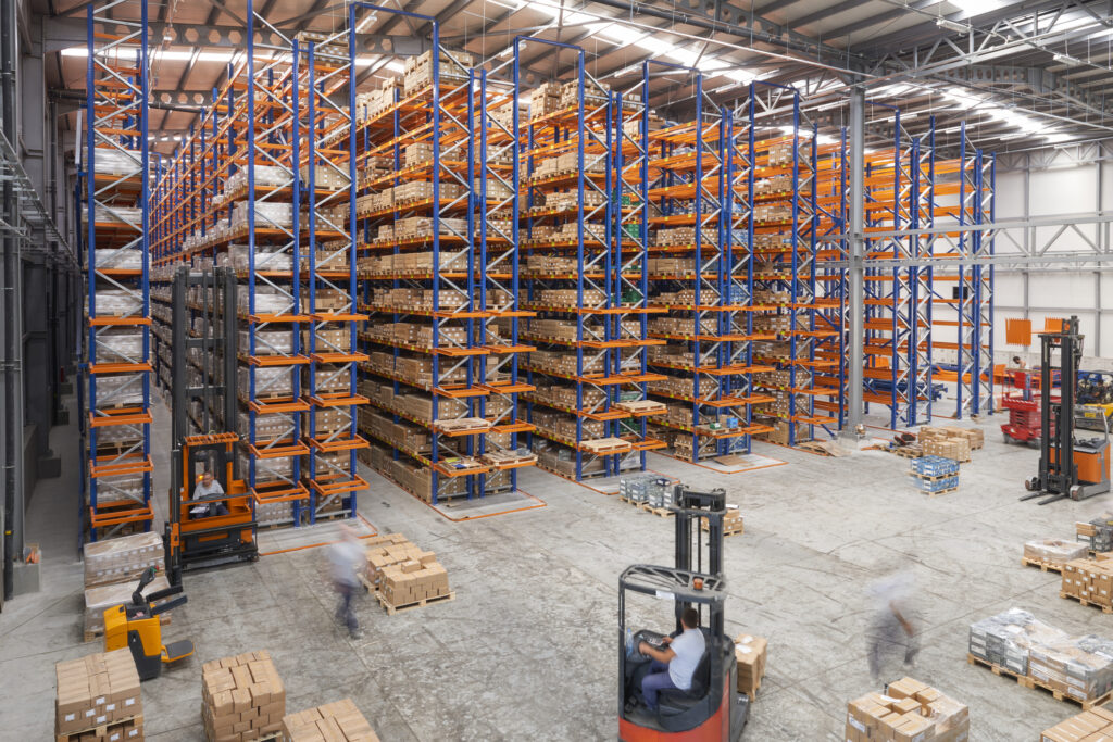 Cardboard boxes on shelves in warehouse. Storhouse.